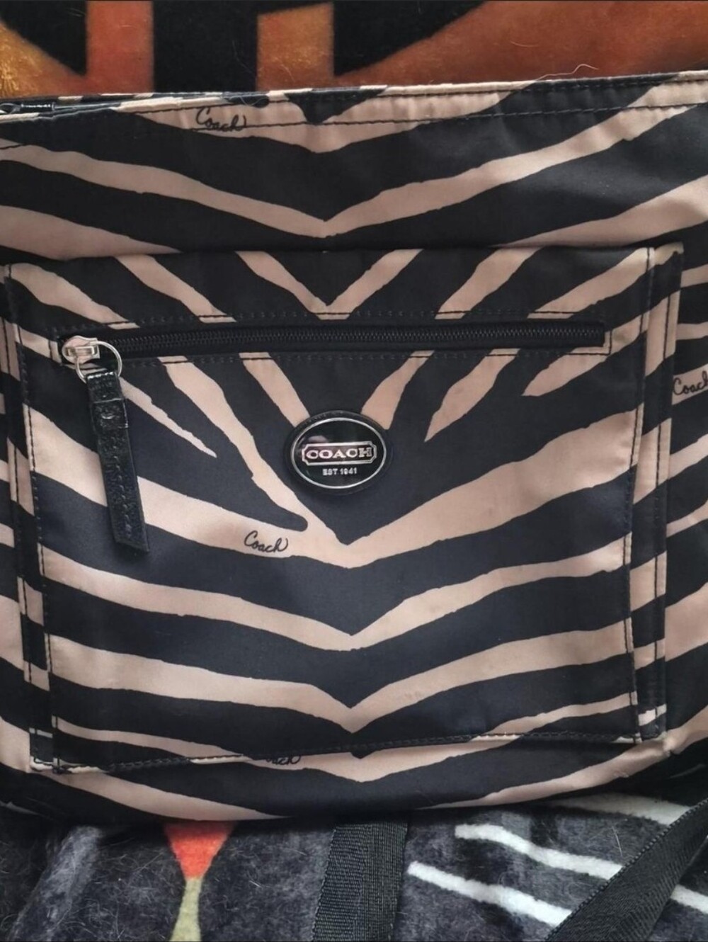 Coach Zebra-Print Crossbody in Black and Beige. Approximately 10"x11".